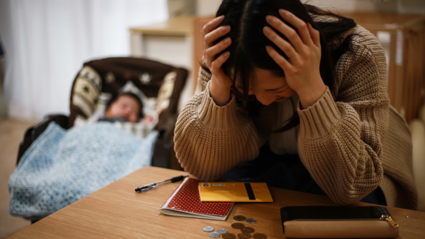 lady holding hands on head in stress
