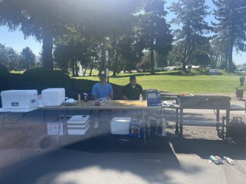 Fibre Federal Credit Union volunteers grilling hot dogs